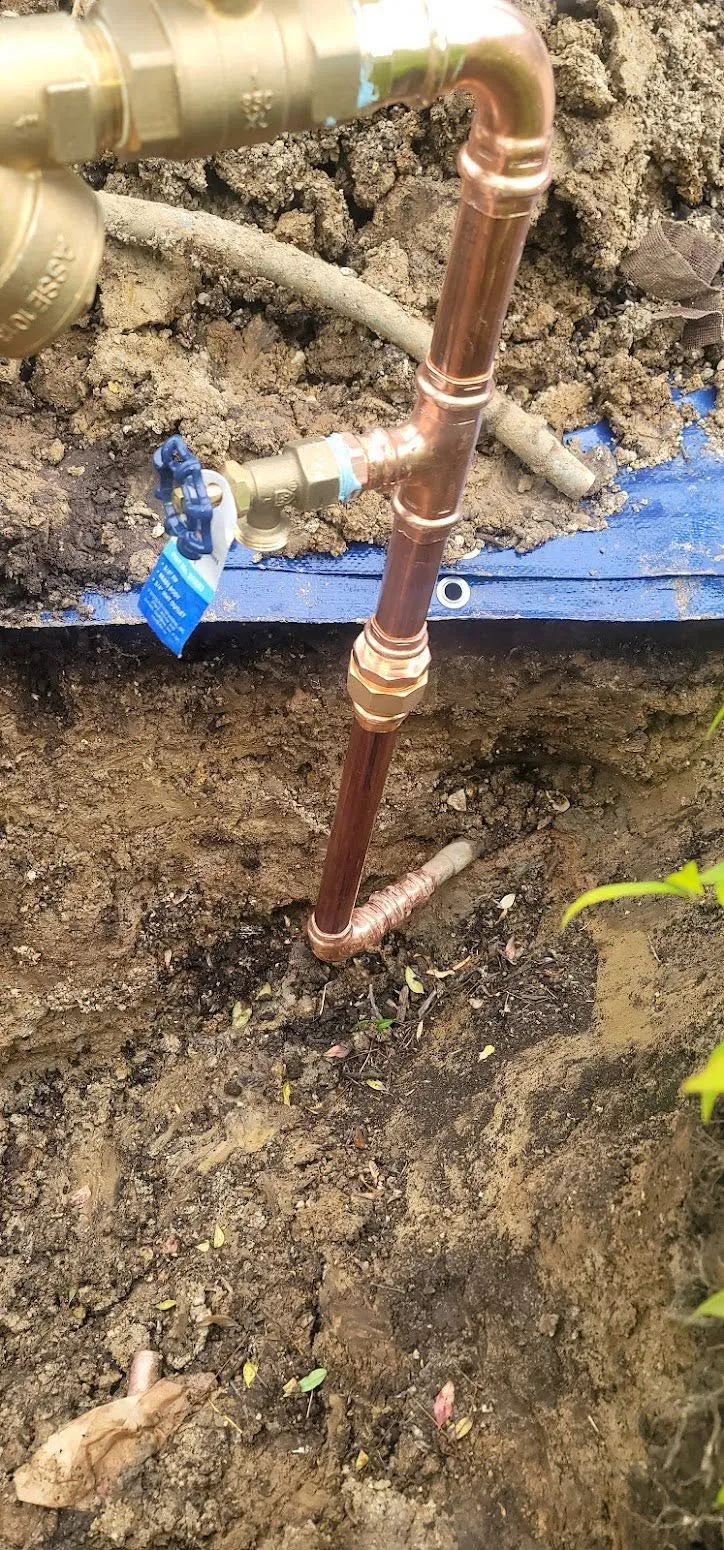 New copper pipe and brass valve installation