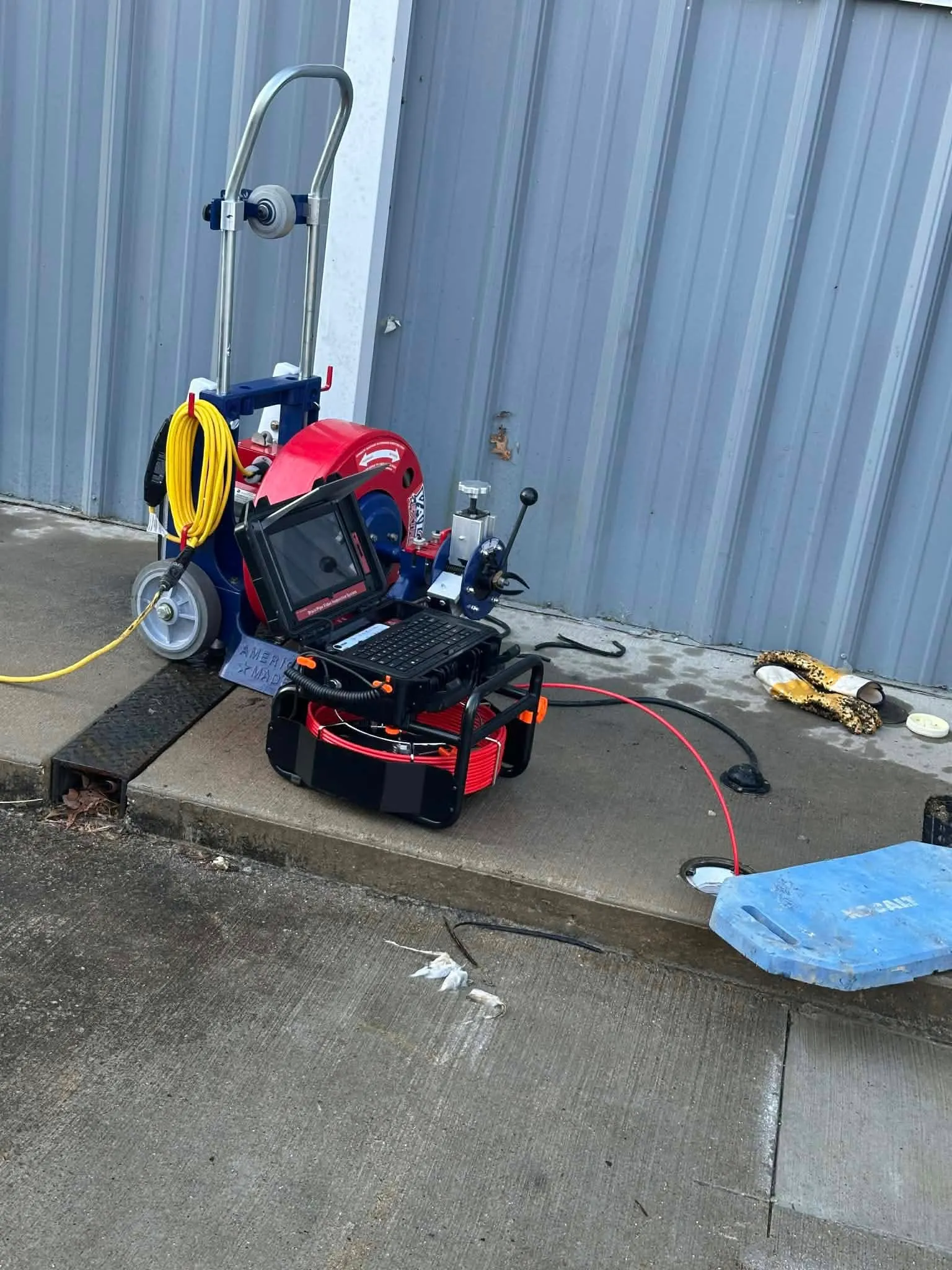 Sewer camera and drain cleaning equipment on a commercial job site